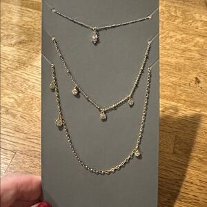 New gold metal triple strand necklace cubic zirconia